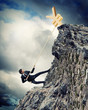 busiessman climbing mountain