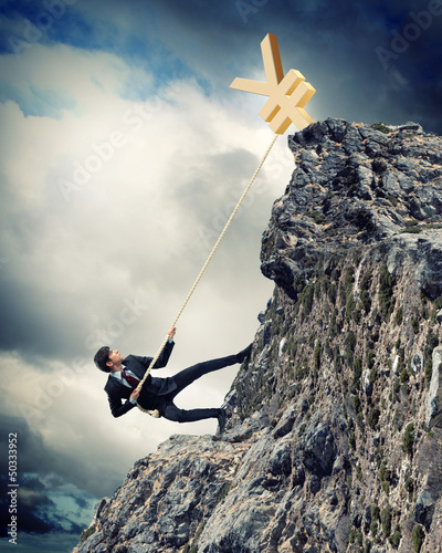 Photo: busiessman climbing mountain busiessman climbing mountain