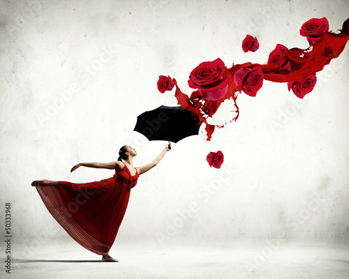 Photo: Ballet dancer in flying satin dress with umbrella Ballet dancer in flying satin dress with umbrella
