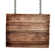 Foto: old wooden signboard with chains isolated old wooden signboard with chains isolated