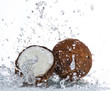 cracked coconut with splashing water