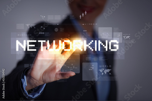 Photo: Business woman touching display Business woman touching display