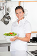 Female Chef Holding Bowl Of Salad