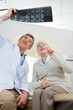 Radiologist And Patient Looking At X-ray