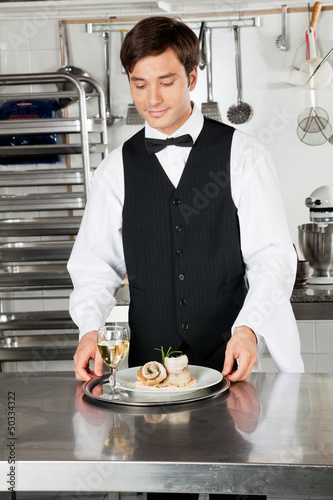 Photo: Waiter With Salmon Roll And White Wine Waiter With Salmon Roll And White Wine