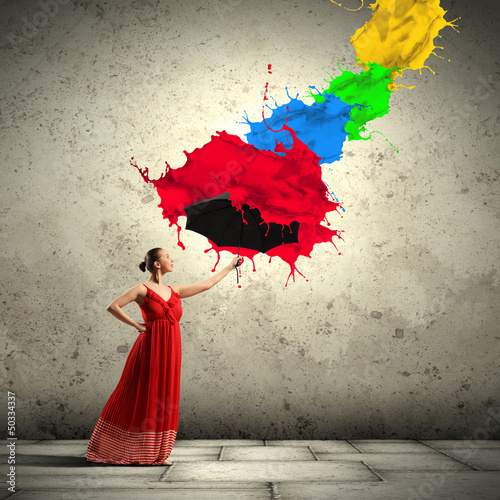 Photo: Ballet dancer in flying satin dress with umbrella Ballet dancer in flying satin dress with umbrella