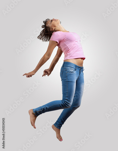 Photo: young woman dancing and jumping young woman dancing and jumping