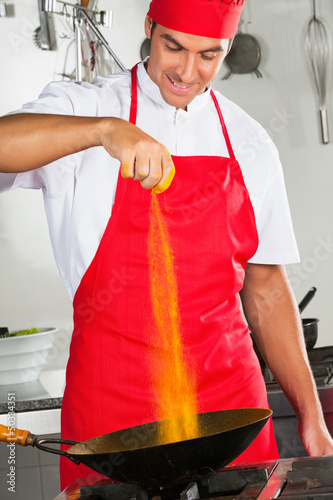 Photo: Chef Adding Turmeric Powder In Pan Chef Adding Turmeric Powder In Pan