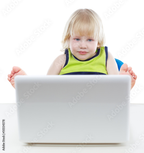 Photo: Young blonde boy looking at computer screen Young blonde boy looking at computer screen