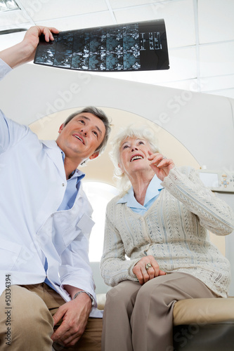 Photo: Radiologist And Patient Looking At X-ray Radiologist And Patient Looking At X-ray