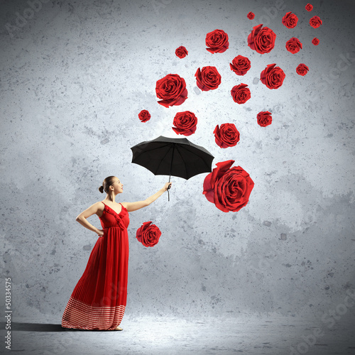 Photo: Ballet dancer in flying satin dress with umbrella Ballet dancer in flying satin dress with umbrella
