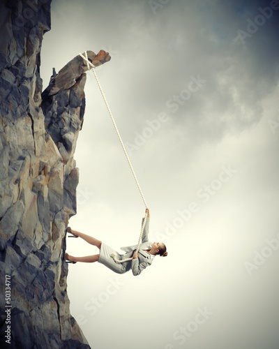 Photo: businesswoman climbing mountain businesswoman climbing mountain