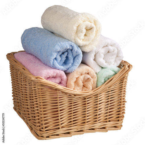 Photo: Fluffy towels in a basket. Fluffy towels in a basket.