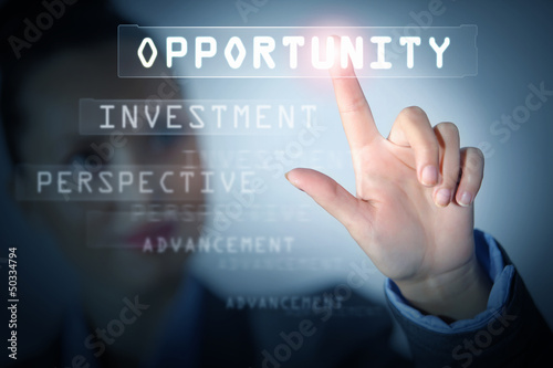 Photo: Business woman touching display Business woman touching display
