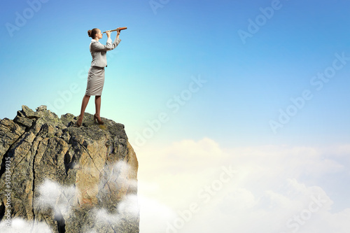 Photo: Business woman with telescope Business woman with telescope
