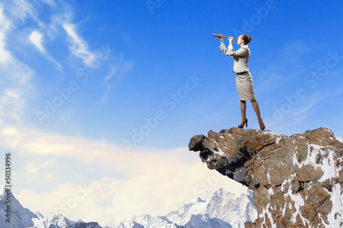 Photo: Business woman with telescope Business woman with telescope