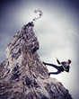 businessman climbing mountain