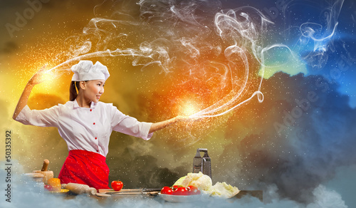 Photo: Asian female cooking with magic Asian female cooking with magic