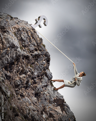 Photo: businesswoman climbing mountain businesswoman climbing mountain
