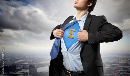 Photo: Businessman showing superman suit underneath shirt Businessman showing superman suit underneath shirt