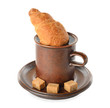 Croissant in a cup of coffee on  a white background