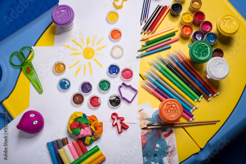 Photo: Table with color pencils, paints, playdough, felt pens and paper Table with color pencils, paints, playdough, felt pens and paper