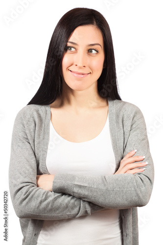 Photo: young woman standing with hands folded young woman standing with hands folded