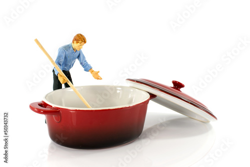 Photo: puppet man stirring in empty saucepan puppet man stirring in empty saucepan
