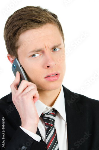 Photo: kritischer geschäftsmann am handy kritischer geschäftsmann am handy