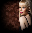 Beautiful blonde woman in luxury fur coat