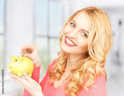 Photo: woman with piggy bank and cash money woman with piggy bank and cash money