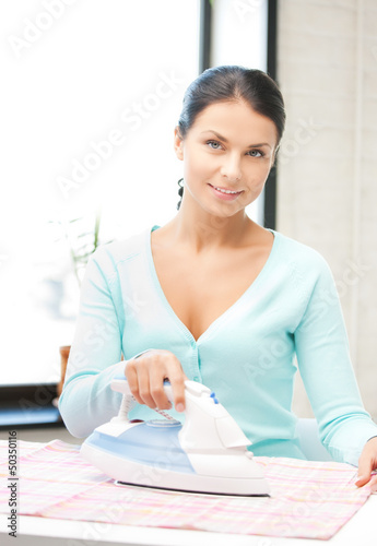 Photo: housewife ironing clothes housewife ironing clothes