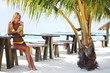 woman in a tropical cafe
