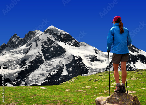 Photo: girl looking at the Breithorn in the Swiss Alps girl looking at the Breithorn in the Swiss Alps