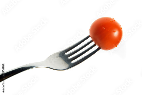 Photo: Cherry tomato on fork Cherry tomato on fork