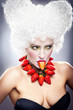 Woman with strawberry necklace, wig and professional makeup