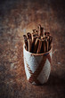 Cinnamon sticks in a ceramic cup