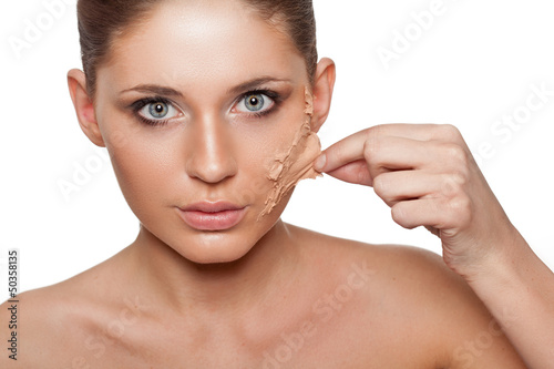 Photo: woman taking off her skin from face woman taking off her skin from face
