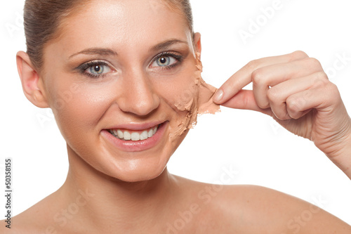 Photo: woman taking off her skin from face woman taking off her skin from face