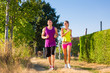 Man and woman running for sport