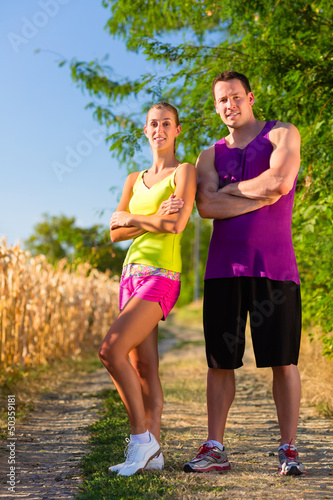 Photo: Man and woman running for sport Man and woman running for sport