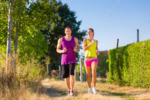 Photo: Man and woman running for sport Man and woman running for sport