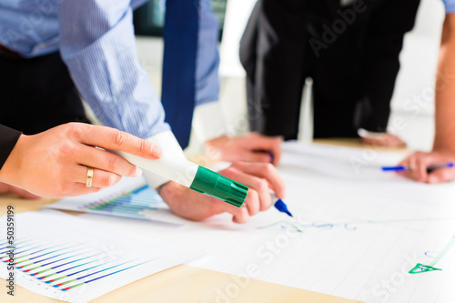 Photo: Business - People in office working as team Business - People in office working as team