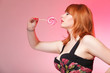 happy redhair woman with lollipop candy