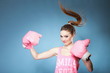 Female boxer model with big fun pink gloves