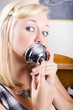 Young Blonde Woman Ringing The Bell Of Lip Service