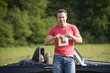 Photo: A young man tearing up an learner driver plate A young man tearing up an learner driver plate