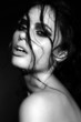 sensual sexy model with wet skin with curly hair