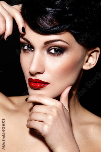 Photo: sexy model with bright makeup,with red lips and clean skin sexy model with bright makeup,with red lips and clean skin