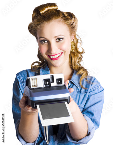 Photo: Woman holding instant camera Woman holding instant camera